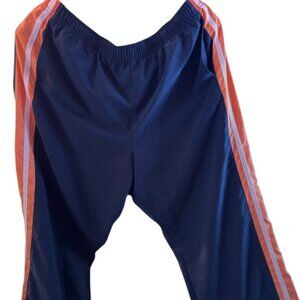 Womens Athletic Nike capris in Blue with orange stripe on the side.